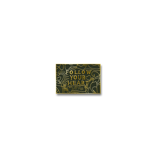 Decorative sign with the text ’FOLLOW YOUR HEART’ surrounded by doodle-style illustrations.